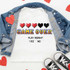 Game Over Sublimation Transfer, an image of a white t-shirt with pixelated hearts and text design, laid flat with a denim jacket and sneakers for display.