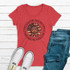 She's a Good Girl Loves Her Mama Screen Print Heat Transfer on a red T-shirt, paired with blue jeans and white sneakers, displayed on a white wooden background.