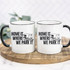 Home Is Where We Park It Sublimation Transfer, two white ceramic mugs with black handles featuring a caravan design and text, displayed on a wooden surface.