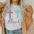 Truly Blessed Sublimation Transfer, colorful cross design on white t-shirt with the words 'Truly Blessed' in stylish font.