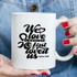 We Love Because Sublimation Transfer, a white ceramic mug with black printed text of a heartfelt Bible verse from 1 John 4:19.