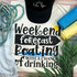 Weekend Forecast Screen Print Heat Transfer, black and white design with a sun icon and playful font, on a white fabric surrounded by accessories and colorful fabric rolls.