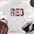 Remember Everyone Deployed Sublimation Transfer on a white T-shirt, featuring a distressed design with black and red text.