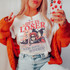 We're Going Witchin' Screen Print Heat Transfer, Halloween-themed graphic t-shirt featuring three women dressed as witches and a cat, with the phrase 'Get in Loser, We're Going Witchin'' in bold letters.