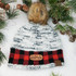 Not Made For Winter TAN Leather Patch, knit winter beanie with a fur pom-pom and a leather patch displayed among pine branches and pinecones.
