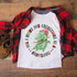 All I Want For Christmas Is A Dinosaur DTF Transfer T-shirt, featuring a cute cartoon dinosaur wearing a Christmas hat with festive decorations around it.