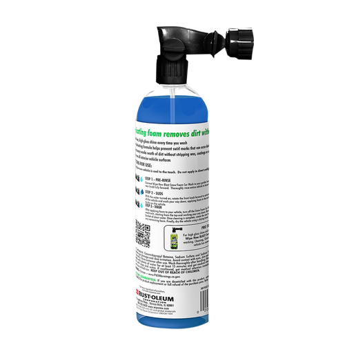 Image of the Wipe New Blue Snow Foam Car Wash product in a translucent blue bottle with an integrated black spray nozzle designed for garden hose attachment. The bottle features a white label with green and black text that details the product's benefits and usage. Visible on the label are step-by-step instructions for pre-rinsing, sudsing, and washing, emphasizing its purpose for effective car cleaning. The overall design highlights the convenience of the spray applicator for creating a thick foam wash.