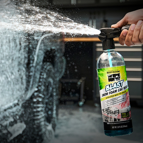 Wipe New Blast Snow Foam Car Wash spraying thick foam onto vehicle, demonstrating high-pressure application for powerful dirt removal and scratch-free cleaning.