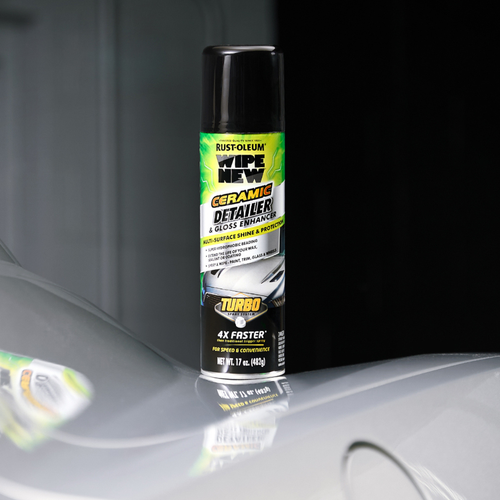 Product display of Wipe New Ceramic Detailer & Gloss Enhancer Turbo placed on hood of silver car showcasing high gloss finish