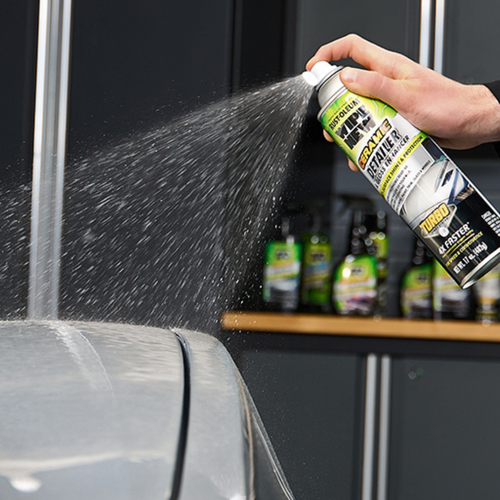 Spraying Wipe New Ceramic Detailer & Gloss Enhancer Turbo onto vehicle paint surface for quick, even application and deep shine