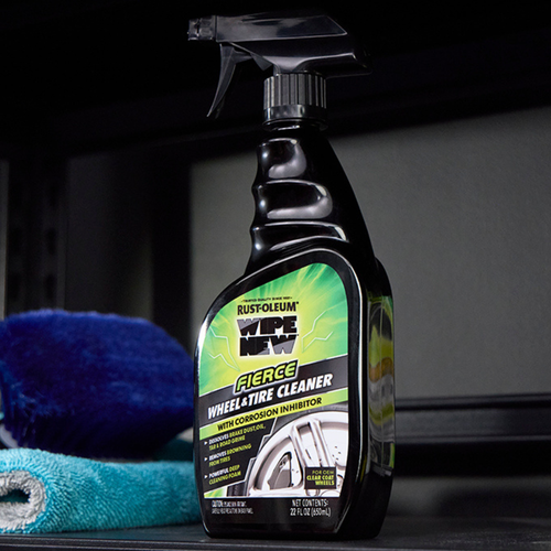 Rust‑Oleum Wipe New Fierce Wheel & Tire Cleaner trigger spray bottle with green label, shown standing upright on a dark surface