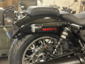 Side view of 4" Delrin frame slider installed on Harley Nightster RH975 shock mount