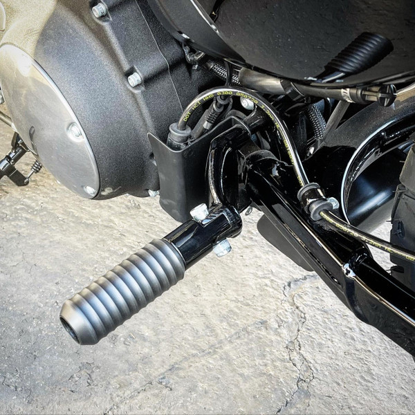 Passenger peg sliders installed on a 2020 Harley-Davidson Sportster, showing rigid steel clevis