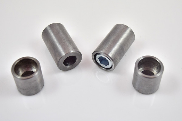Close-up of weld-on counterbored steel bung for 3/8-inch socket head cap screw, machined from 3/4-inch mild steel with flush mount design.