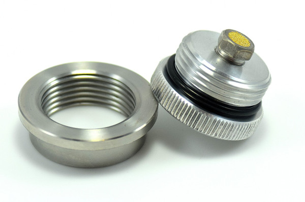 Compact vented filler cap and weld-in bung kit with internal brass vent, available in steel, aluminum, or stainless steel.