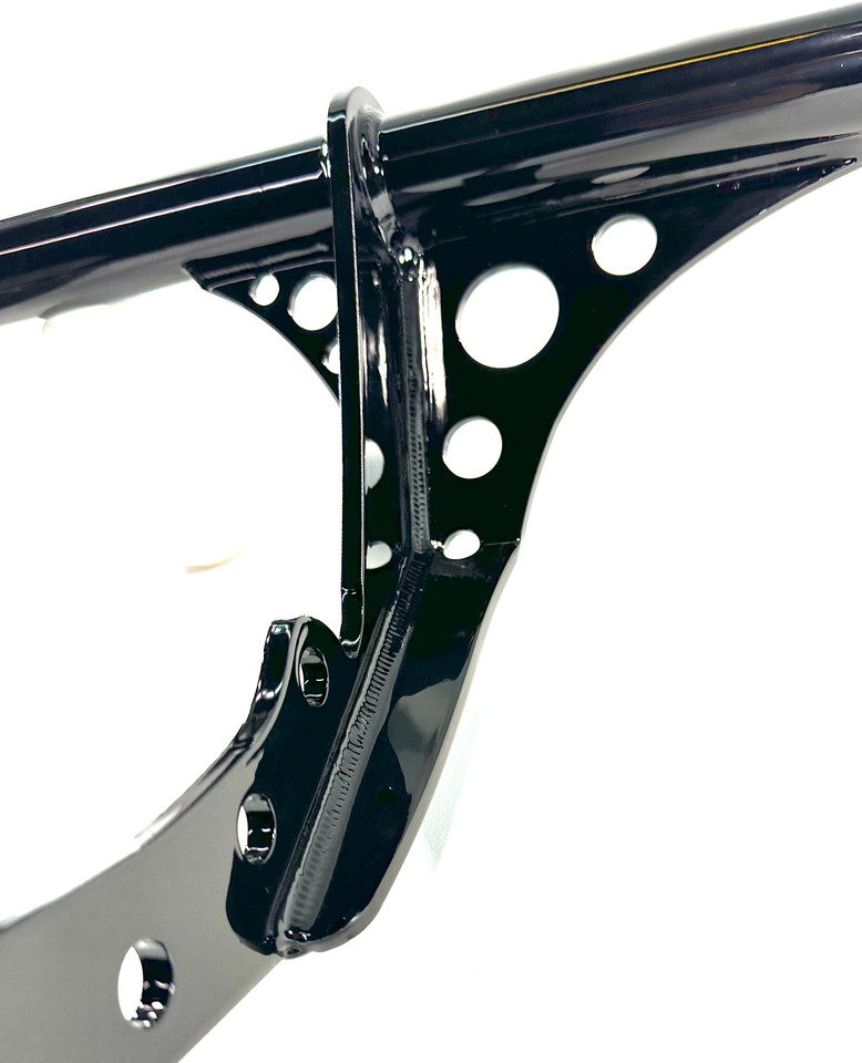 Close-up of Delrin slider on Bung King crash bar for Harley Softail