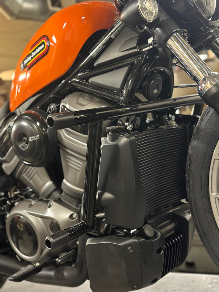 Revo Twin crashbar installed on Harley Sportster with mid controls, with replaceable Delrin sliders visible Revo Twin crashbar installed on Harley Sportster with mid controls, with replaceable Delrin sliders visible