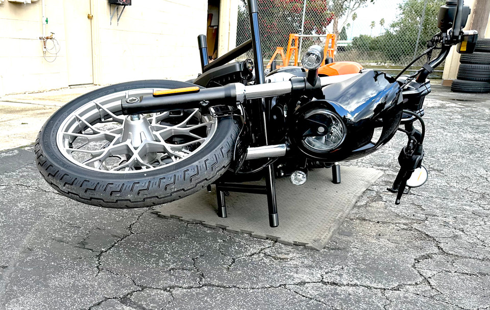 Nightster RH975 using upper shock sliders to protect frame during tip-over