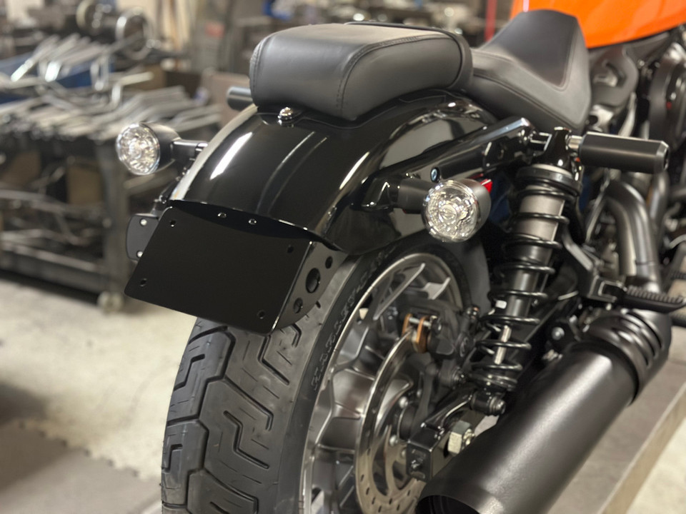 License plate relocation installed on 2022 Harley Nightster RH975 rear fender side view