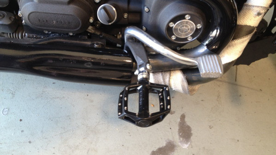 Universal BMX pedal footpeg adapters for Harley motorcycles, tapped for 9/16"-20 thread, compatible with MTB or BMX pedals, sold in pairs.