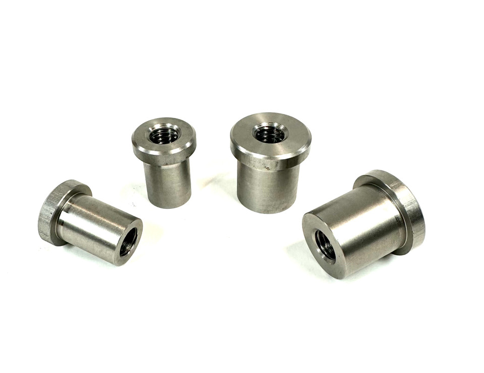 Side-by-side view of 1-inch and 1-1/4 inch large stepped bungs for custom fabrication