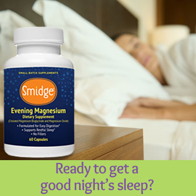 Womsn sleeping next to a bottle of Smidge Evening Magnesium natural sleep aid supplement.