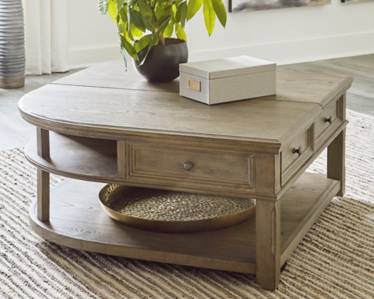 The Janismore Lift Top Coffee Table is available at Leisure Tyme