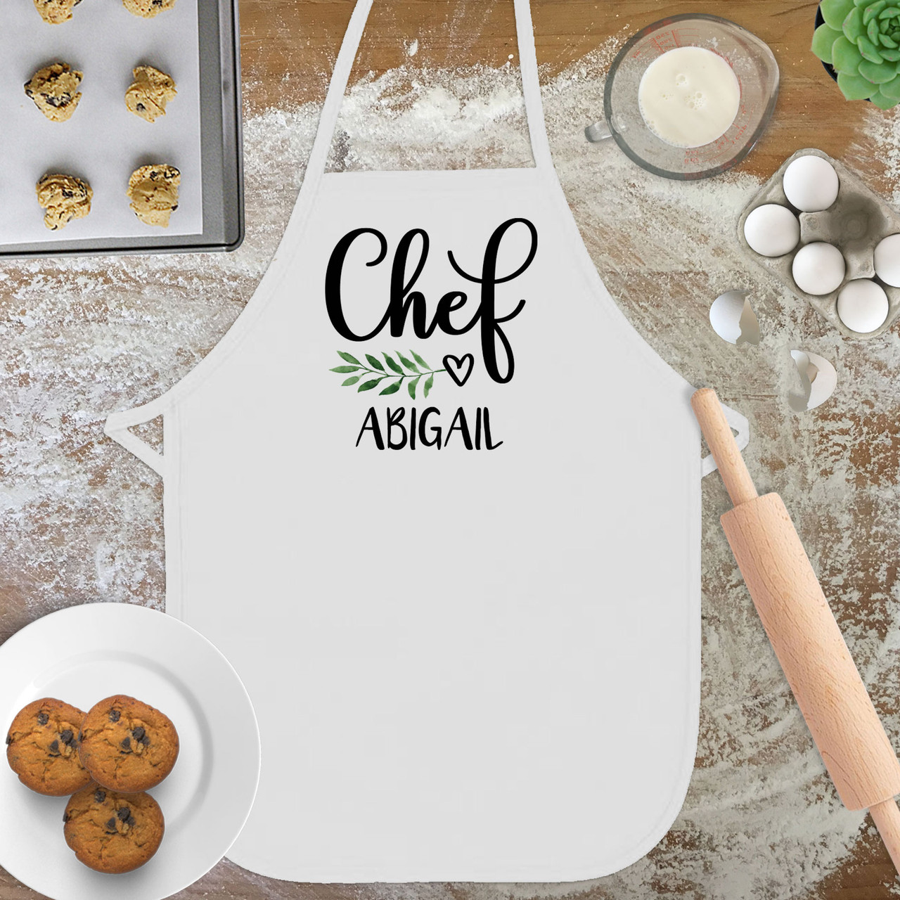 https://cdn11.bigcommerce.com/s-5grzuu6/images/stencil/1280x1280/products/4833/50566/Leaf-Heart-Personalized_Kids-Chef_Apron__65198.1666133600.jpg?c=2
