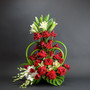 My Sweetheart is a tall vertical tower luxury signature red rose arrangement featuring  orchids, white lilies, tropical greens and a dramatic sculptural modern style by Lexis Florist in Houston