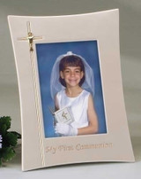 9.25" First Holy Communion Frame. Holds a 4" x 6" picture. Frame is adorned with Cross and Chalice on left side of frame. 