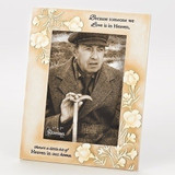 This resin/stone 9.25 Memorial Frame holds a 5" x 7" photo. Dimensions:  9.06"H x 0.60"W x 7.09"L