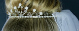 Tiara veil with rhinestone circlet base embellished with pearls, crystal flowers and more. 2 layers of tulle. 