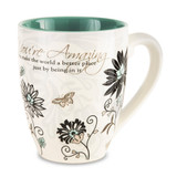 From the Mark My Words Collection comes this 4.75" ~ 17 ounce ceramic mug.  "You're Amazing! You make the world a better place just by being in it." written on front of mug.