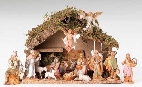 Nativity set with 15 figures and a stable made of wood, moss, bark, and polymer. 