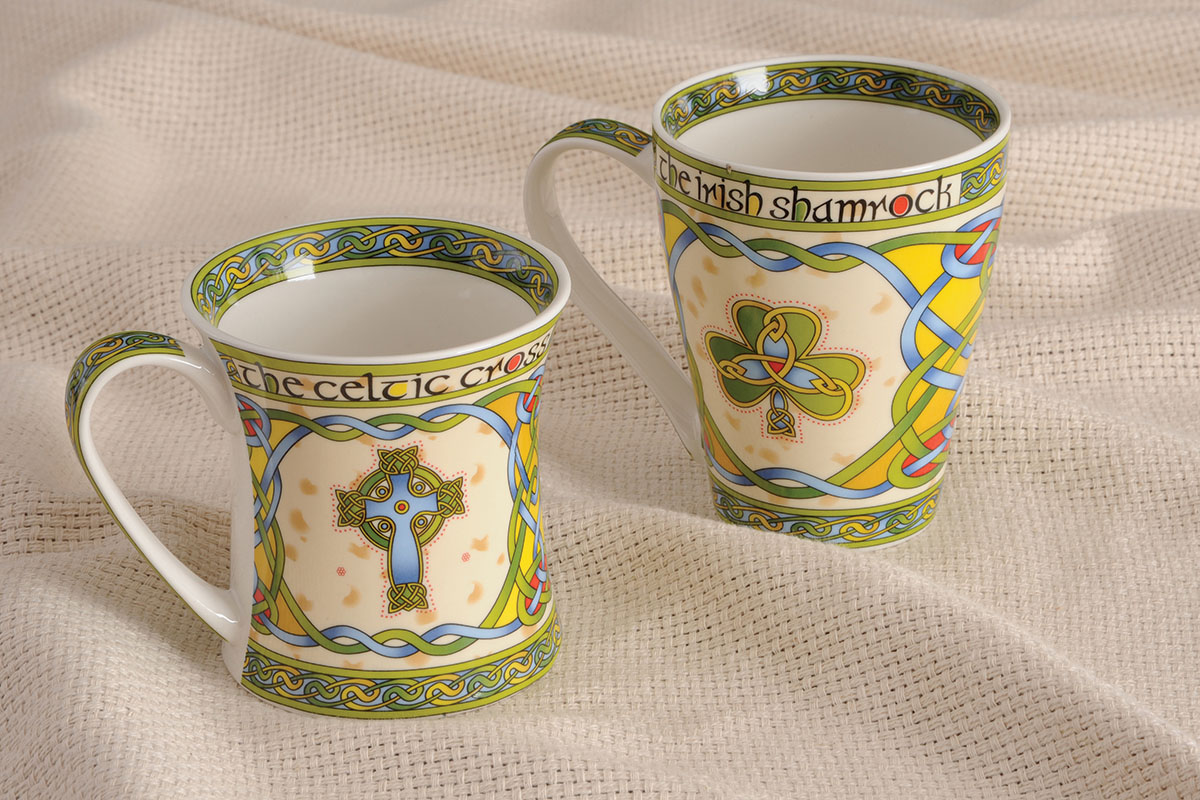 These one China Mugs depict a Shamrock and a High Celtic Cross in the style of 9th century ancient Celtic manuscripts which would have been painted by monks onto vellum or calf skin. Both Mugs are Microwave and Dishwasher safe.

A. Celtic Cross Mug-Hold 11 ounces or

B. Shamrock Mug- Holds 13 ounces 