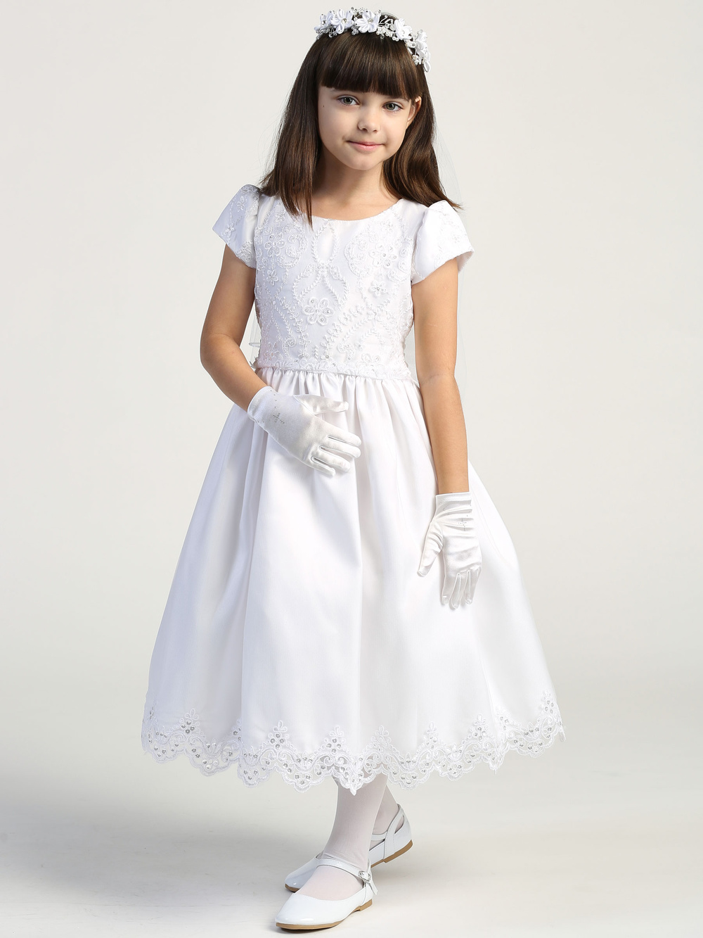 Tulle and organza skirt
Embroidered and sequined bodice
Corded and embroidered trim
Cap-length puff sleeves
Tea length
Made in the U.S.
3 Dress Limit per Order!