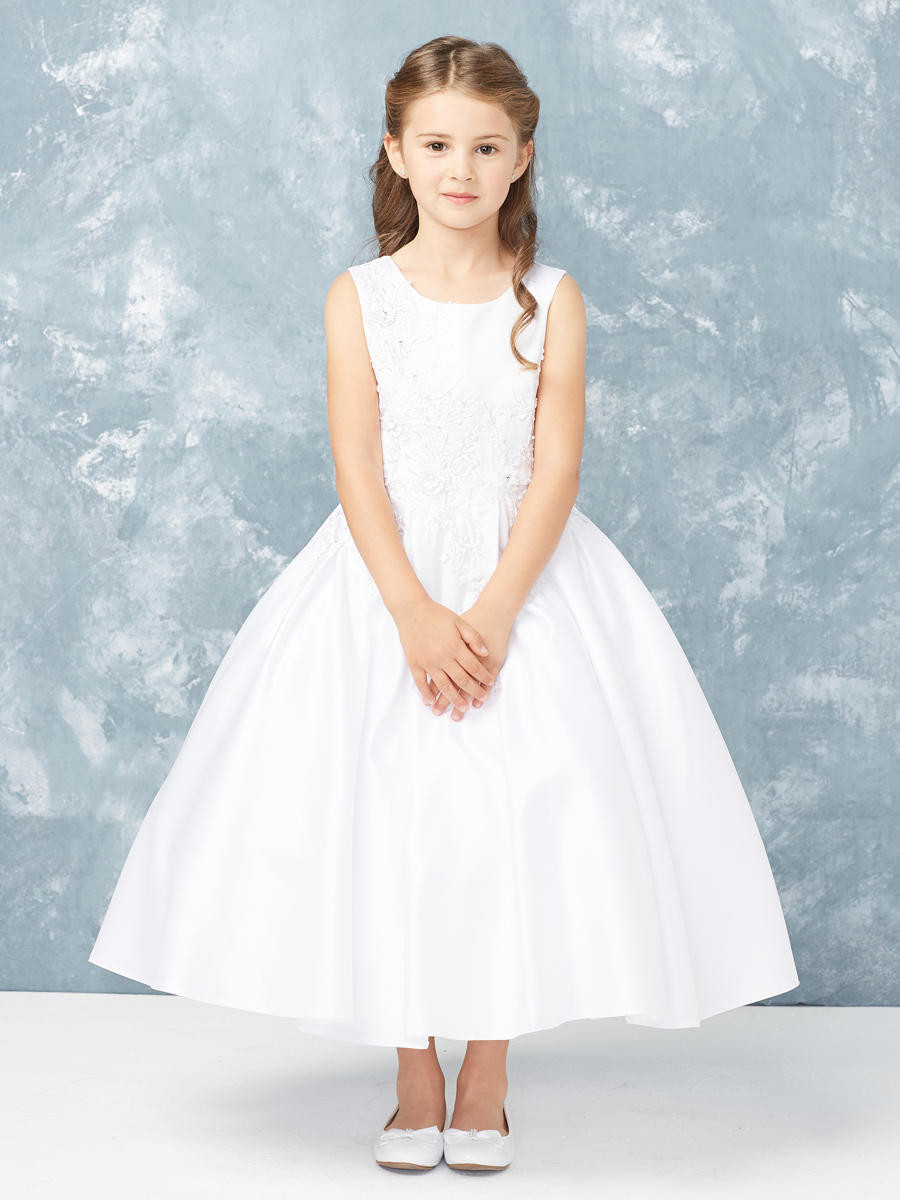 This satin communion dress is ankle length and has lace applique. 3 Dress Limit per Order.