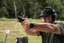Shooter with M&P Shield X with mounted Holosun RMR and Streamlight TLR-7X