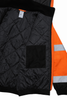 Interior close-up of high-visibility insulated bomber jacket showing black quilted liner and inner chest pocket