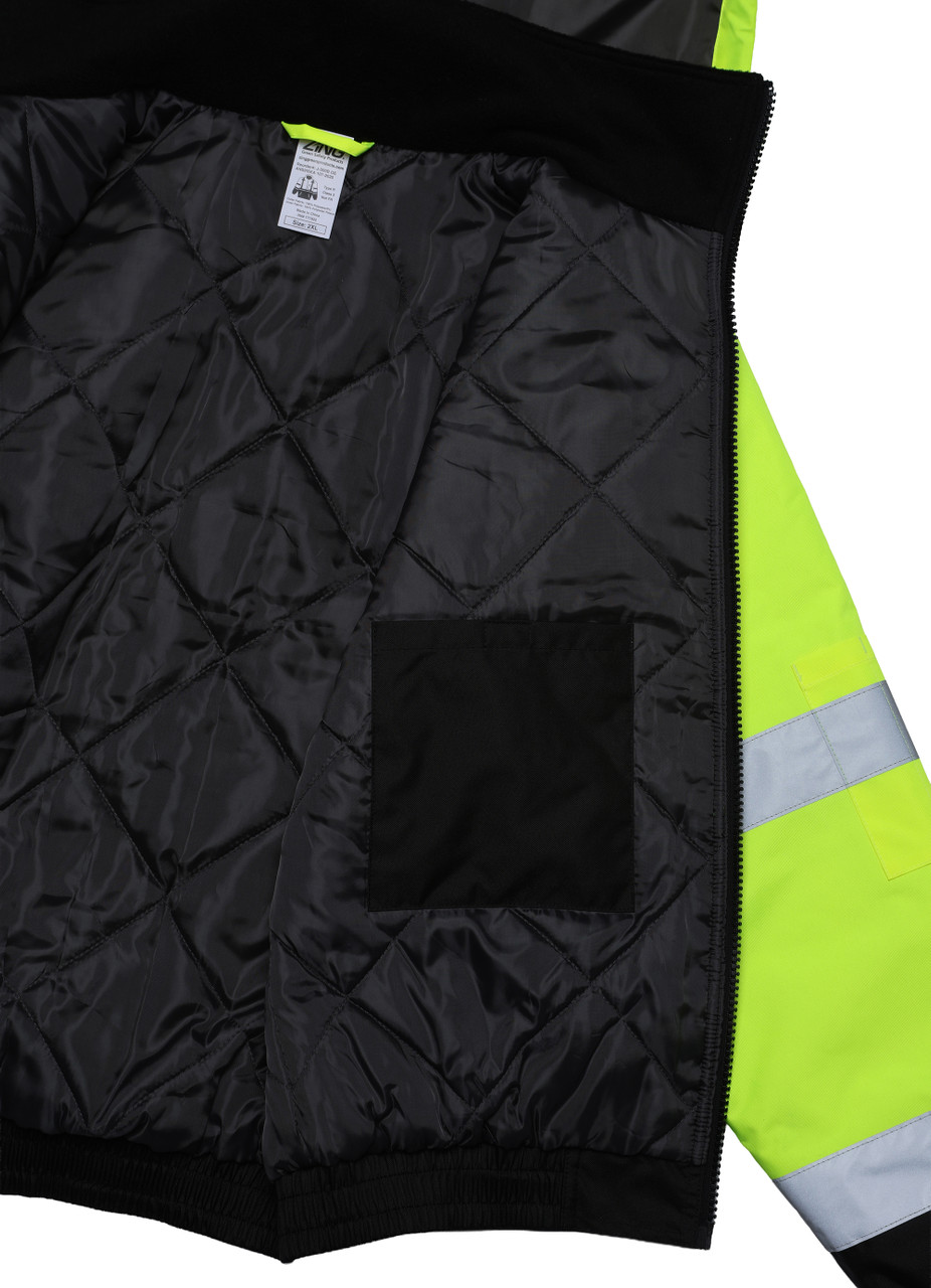 Interior close-up of high-visibility insulated bomber jacket showing black quilted liner and inner chest pocket