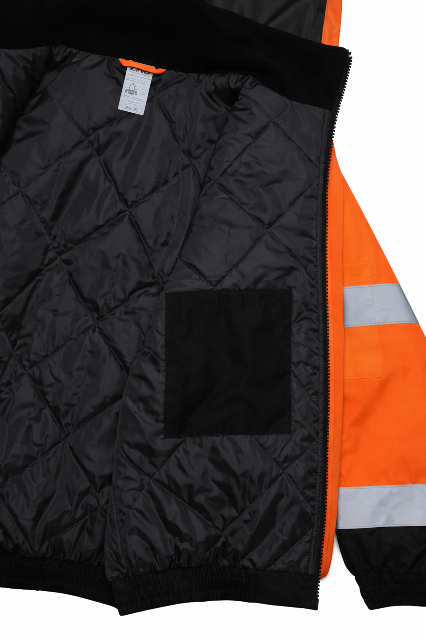 Interior close-up of high-visibility insulated bomber jacket showing black quilted liner and inner chest pocket