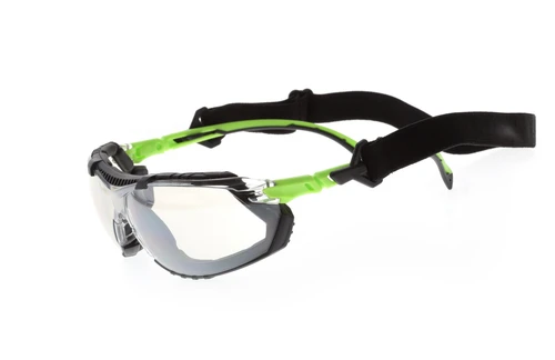 Safety glasses with clear lens, removable black foam gasket, and elastic strap, angled top view