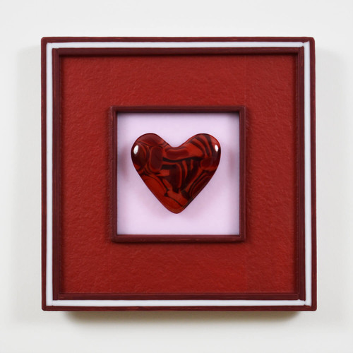 Deep red cast glass heart with complementary, 3D kilncarved glass handmade frame.