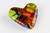 Chromatic Cast Glass Heart Paperweight with Shades of Blue, Green, Orange and Yellow Side View