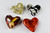 Grouping of Four Cast Glass Heart Paperweights: Fall Color Scheme