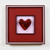 Deep red cast glass heart with complementary, 3D kilncarved glass handmade frame.