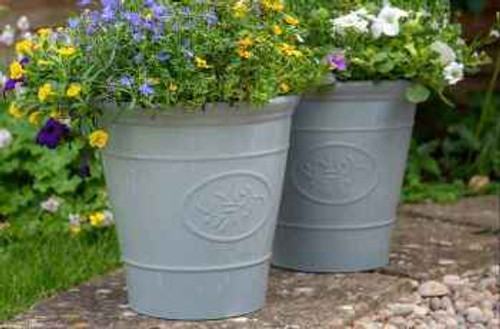 two fancy decorative pots in a garden