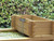 falling water feature in a wooden garden pond