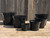 Black plastic pots in 6 different sizes