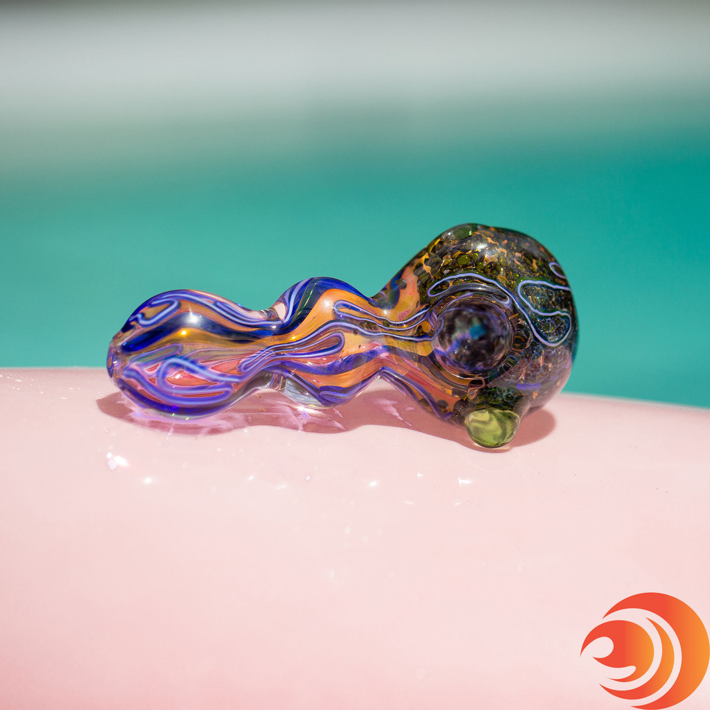 This purple heavy glass pipe has a slightly psychedelic look from Atomic Blaze glass smoke pipe shop.